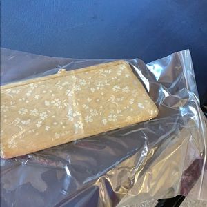 Antique cream satin embroidered clutch with snap